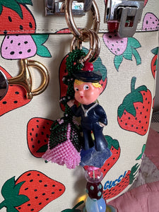 The bag charm with the pink rose and the funny sailor boy