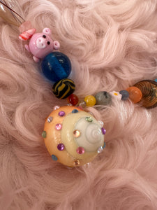 The one with the piglet and the multicoloured rhinestone shell part 4